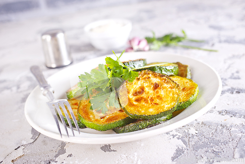 Image of Heap of fried green zucchini with garlic