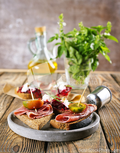 Image of Traditional Spanish Jamon Serrano ham, Prosciutto Crudo, Parma ham, Italian antipasto