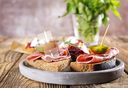 Image of Traditional Spanish Jamon Serrano ham, Prosciutto Crudo, Parma ham, Italian antipasto