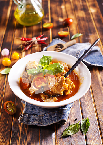 Image of Homemade meat and vegetable stew or soup with tomato