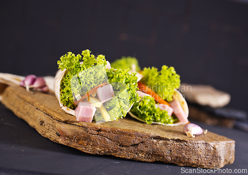 Image of Fresh tortilla wraps with ham cheese and vegetables