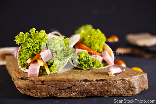 Image of Fresh tortilla wraps with ham cheese and vegetables
