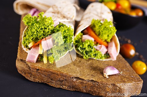 Image of Fresh tortilla wraps with ham cheese and vegetables