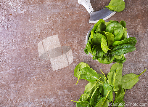 Image of Heap of baby spinach leaves on a table