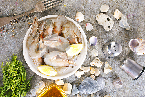Image of raw shrimps on white plate