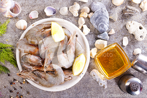 Image of raw shrimps on white plate