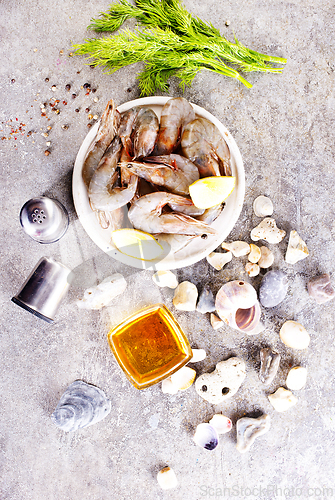 Image of raw shrimps on white plate