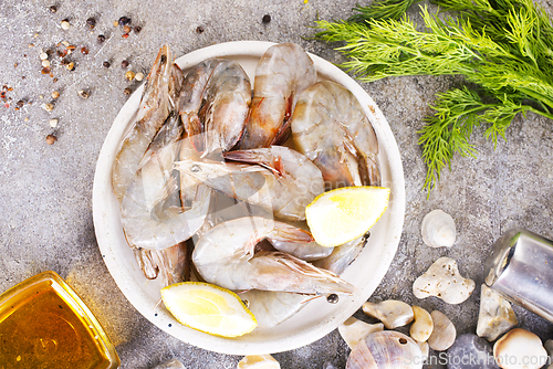 Image of raw shrimps on white plate