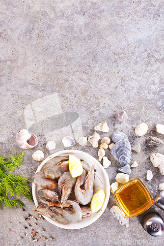 Image of raw shrimps on white plate