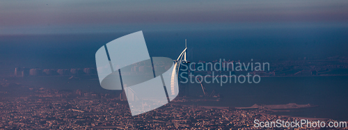 Image of Skyline of Dubai beachfront with Burj Al Arab hotel on Jumeirah beach seen from Burj Khalifa viewpoint.