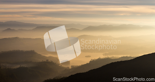 Image of View from Adam's peak, Sri Lanka. Valley view with lakes and mountains at sunrise
