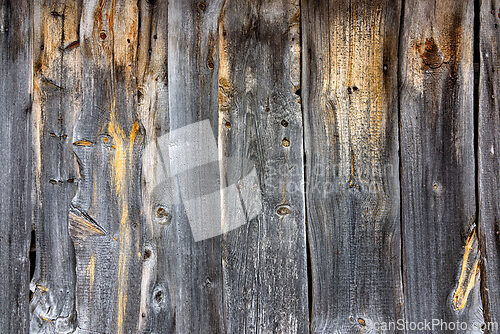 Image of Weathered wooden planks in rustic gray tones with subtle hints o