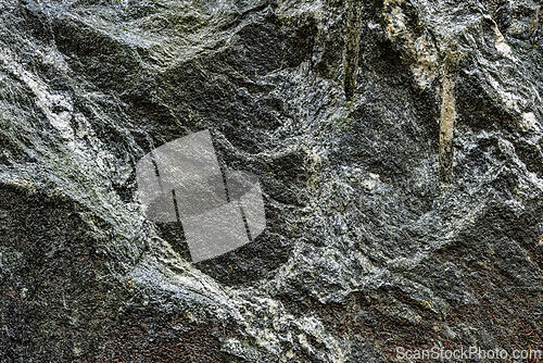 Image of Textured gray rock surface with intricate patterns found in a na