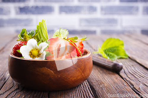 Image of Close up of ripe organic strawberry food wooden table