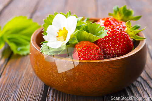 Image of Close up of ripe organic strawberry food wooden table