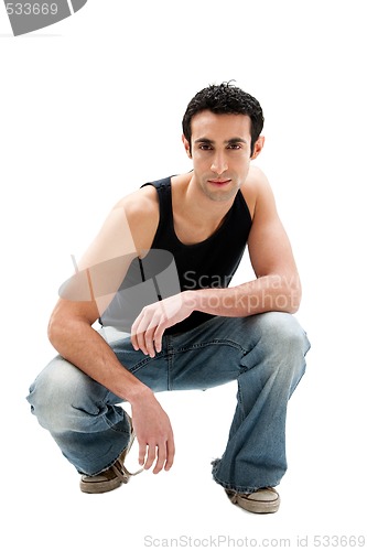 Image of Handsome guy squatting