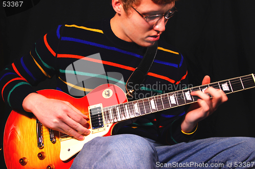 Image of Young Man Playing Electric Guitar