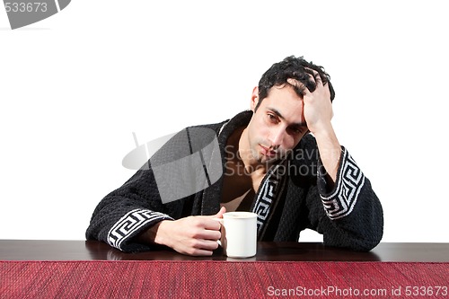 Image of Guy with mug feeling bad