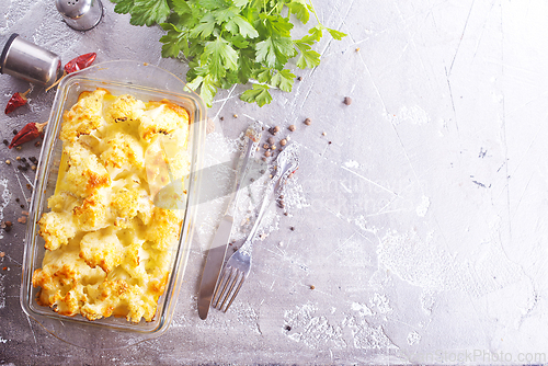 Image of Cauliflower cheese in a baking dish on a table