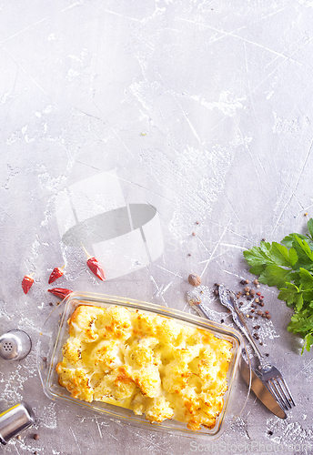 Image of Cauliflower cheese in a baking dish on a table