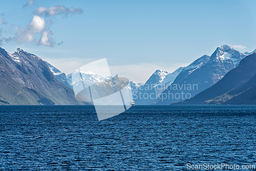 Image of Majestic mountains and serene waters create a breathtaking view 