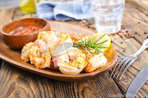Image of Fried shrimps with garlic, lime and fresh rosemary