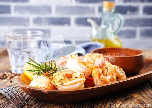 Image of Fried shrimps with garlic, lime and fresh rosemary