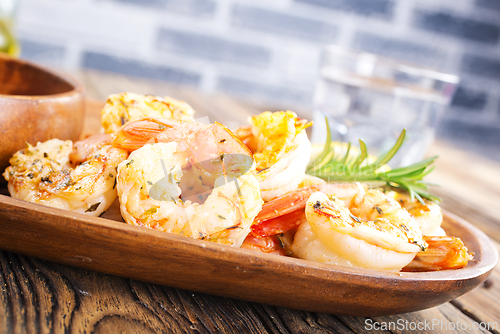 Image of Fried shrimps with garlic, lime and fresh rosemary