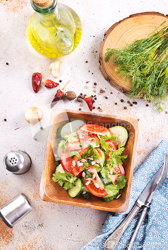 Image of Vegetable salad in wooden bowl