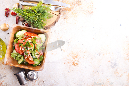 Image of Vegetable salad in wooden bowl