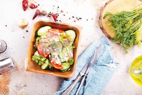 Image of Vegetable salad in wooden bowl