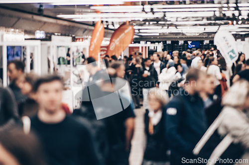 Image of Abstract blurred people at exhibition hall of expo event trade show. Business convention show or job fair. Business concept background.