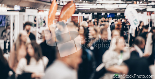 Image of Abstract blurred people at exhibition hall of expo event trade show. Business convention show or job fair. Business concept background.