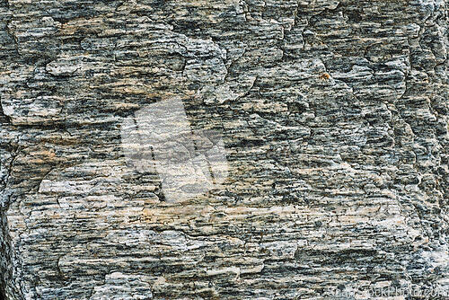 Image of Natural texture of ancient rock formation with layered patterns 
