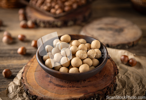 Image of Roasted hazelnuts covered with white chocolate