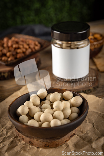 Image of Bowl of white chocolate covered peanuts