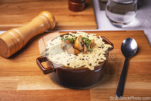 Image of Mushroom cream soup with cheese topping