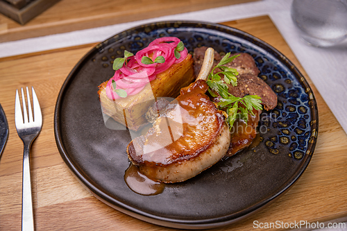 Image of Grilled pork chop with potato gratin