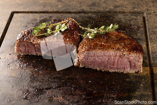 Image of Sizzling medium rare filet mignon steaks