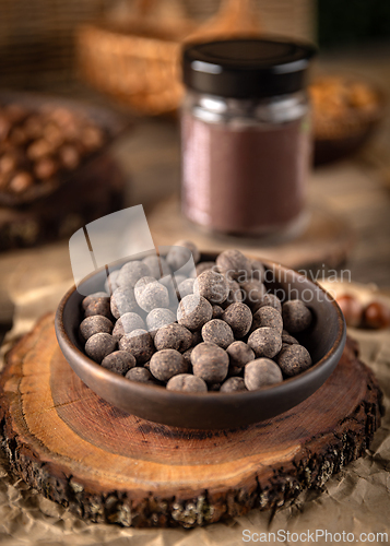 Image of Bowl of chocolate covered hazelnuts