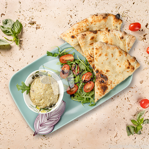Image of Baba ghanoush, pita bread