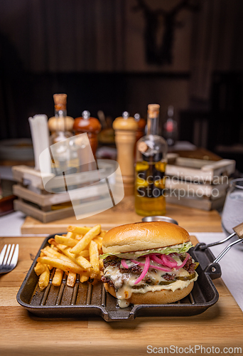 Image of Delicious burger with french fries