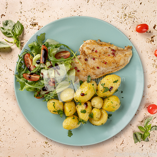 Image of Grilled chicken breast with roasted potatoes