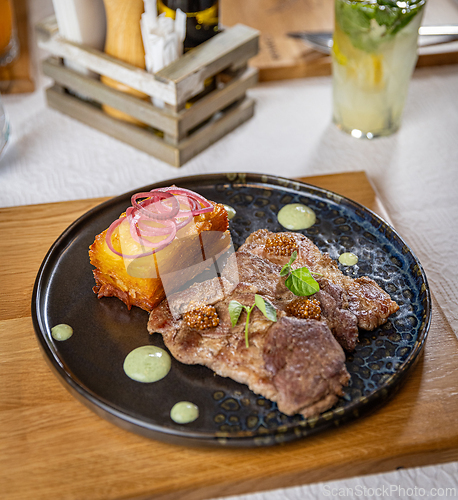 Image of Grilled pork with potato gratin
