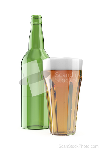 Image of Glass of beer in front of an empty green bottle