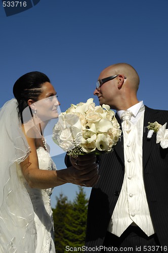 Image of Wedding bouquet and wedding couple