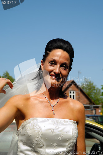 Image of Happy bride in white dress