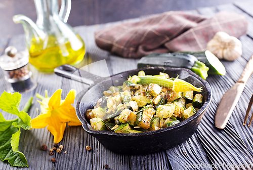 Image of Baked vegetables in pan on a table, close up view