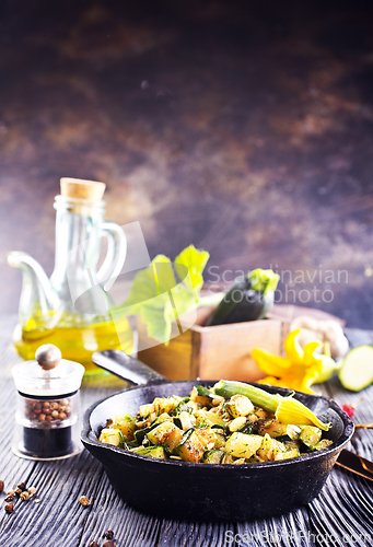 Image of Baked vegetables in pan on a table, close up view