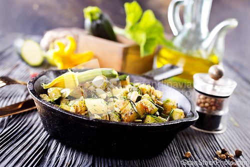 Image of Baked vegetables in pan on a table, close up view